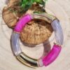 Bracelet en perles tubes incurvés gris, rose fuchsia et doré