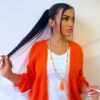 Sautoir perles bois naturel et orange avec pompon