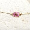 Bracelet en plaqué or avec médaille ovale vieux rose